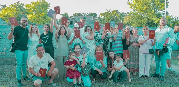 Chergash community holding New Testament